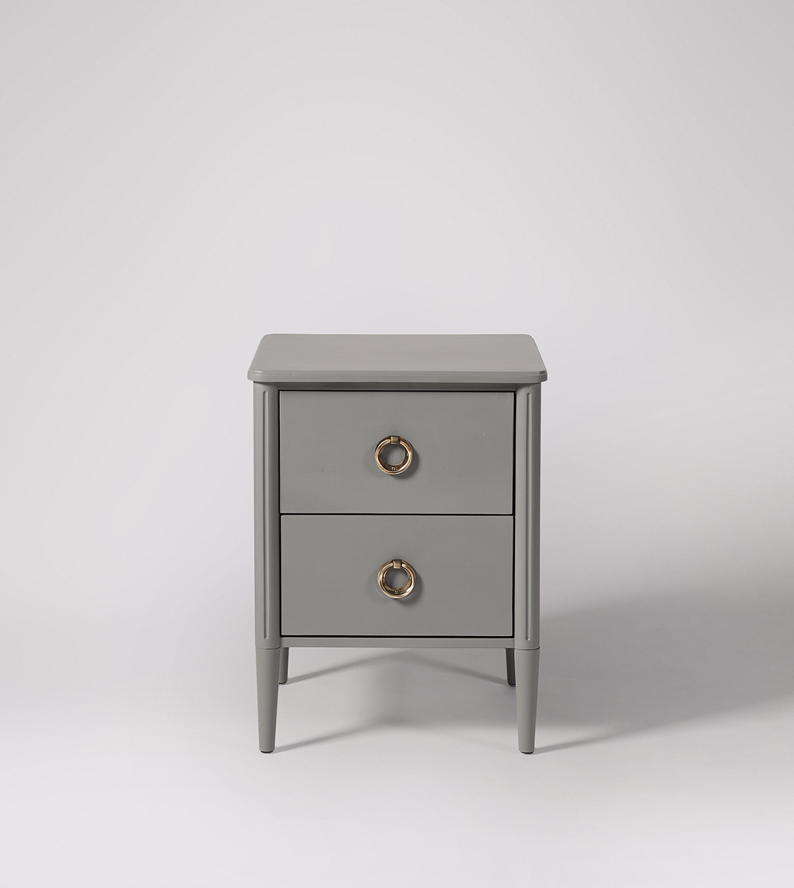 grey and brass nightstand